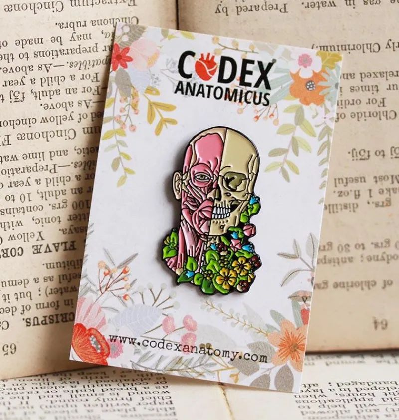 Codex Anatomicus Enamel Pins^Facial muscles and skull with flowers - Enamel pin