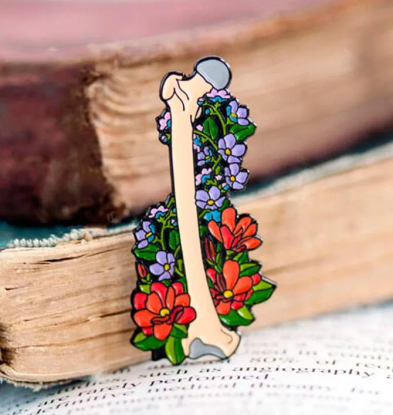 Codex Anatomicus Enamel Pins^Femur with flowers - Enamel pin