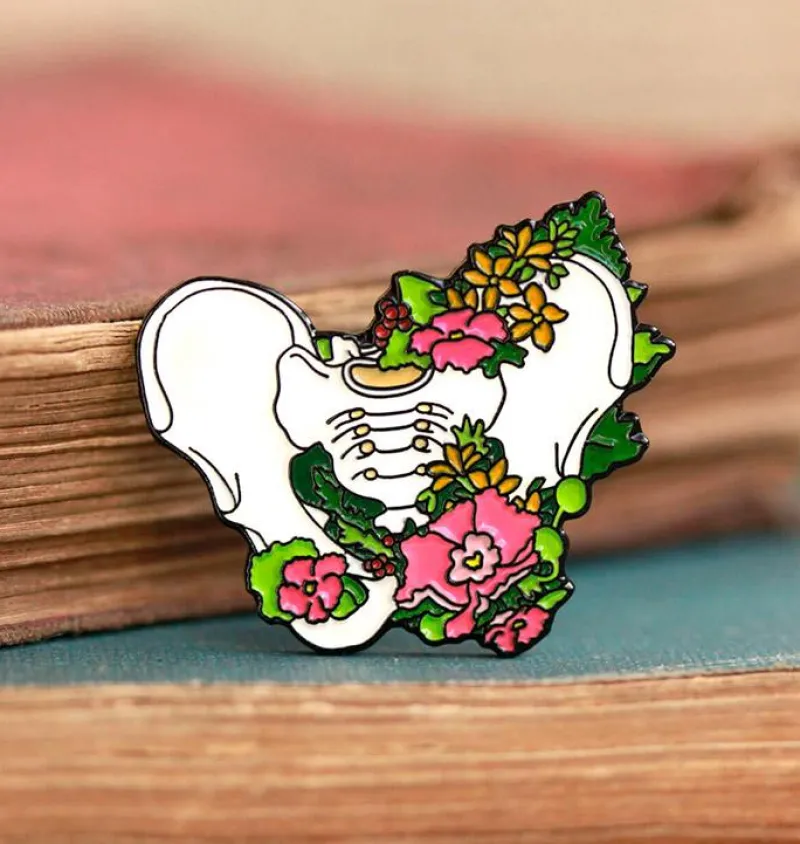 Codex Anatomicus Enamel Pins^Pelvic bone with flowers - Enamel pin